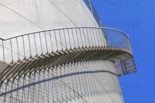 The staircase runs along a large tank in front of a clear blue sky, high tank, chemical, company, Grenzach- Wyhlen, Baden-Württemberg, Germany