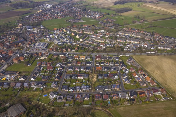 Aerial view, residential area local view district Dolberg, new REWE supermarket with solar roof, wind turbines, new roundabout Alleestraße and Uentroper Straße, new residential area Hases Wiese, Ahlen, Dolberg, Ruhr area, Germany, residential area, local view, district, REWE supermarket, solar roof, roundabout, Alleestraße, Uentroper Straße, new development, Hases Wiese, shopping, renewable energy, transport, roads, infrastructure, development, housing, urban planning, environmental protection, architecture, urban planning, suburban, development area, sustainability, green energy, urban, landscape, technology, innovation, community, energy efficiency