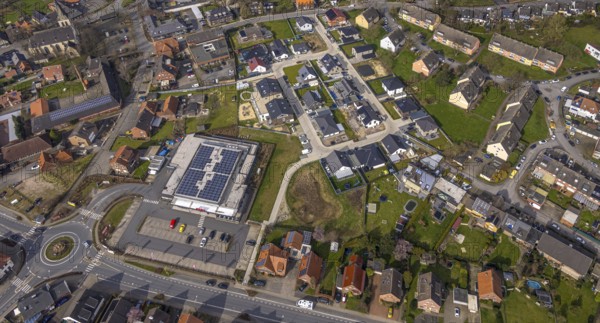 Aerial view, residential area local view district Dolberg, new REWE supermarket with solar roof, wind turbines, new roundabout Alleestraße and Uentroper Straße, new residential area Hases Wiese, catholic St. Lambertus church, Ahlen, Dolberg, Ruhr area, Germany, residential area, local view, district, REWE supermarket, solar roof, roundabout, Alleestraße, Uentroper Straße, new building, Hases Wiese, catholic, St. Lambertus Church, energy, sustainability, architecture, urban planning, infrastructure, urban, buildings, residential buildings, roads, traffic, religion, business, retail, solar energy, renewable energy, community, landscape, environment, technology
