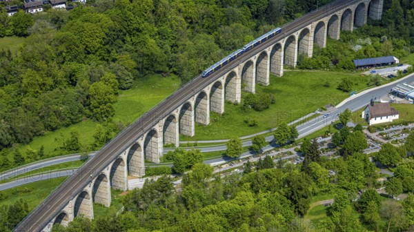 Aerial view, Altenbekener Viaduct, Adenauerstraße, railway viaduct bridge construction, also called Bekeviaduct or Great Viaduct, suburban railway, Altenbeken cemetery and Kreuzkapelle on the Alter Kirchweg road, Altenbeken, East Westphalia, North Rhine-Westphalia, Germany, railway viaduct, bridge construction, Beke Viaduct, Great Viaduct, Altenbeken Cemetery, Chapel of the Cross, Alter Kirchweg, bridge, traffic, infrastructure, building, architecture, landscape, railway, rail traffic, trains, cemetery, chapel, religion, Christianity, historical, geography, travel, outdoor shot, daylight, nature
