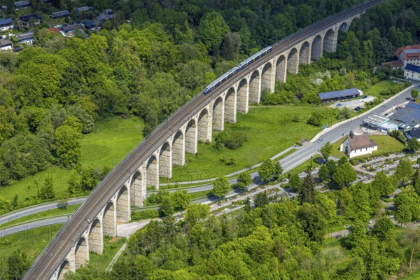 Aerial view, Altenbekener Viaduct, Adenauerstraße, railway viaduct bridge construction, also called Bekeviaduct or Great Viaduct, suburban railway, Altenbeken cemetery and Kreuzkapelle on the Alter Kirchweg road, Altenbeken, East Westphalia, North Rhine-Westphalia, Germany, railway viaduct, bridge construction, Beke Viaduct, Great Viaduct, Altenbeken Cemetery, Kreuzkapelle, Alter Kirchweg, traffic, infrastructure, railway, bridge, architecture, landscape, route, transport, history, historical, structure, rails, train, top view, perspective, sky, trees, nature, city, rural, travel, technology