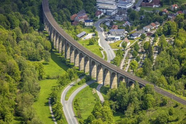 Aerial view, Altenbeken Viaduct, Adenauerstraße, railway viaduct bridge construction, also called Beke Viaduct or Great Viaduct, Altenbeken Cemetery and Kreuzkapelle Alter Kirchweg, Altenbeken, East Westphalia, North Rhine-Westphalia, Germany, railway viaduct, bridge construction, Beke Viaduct, Great Viaduct, Altenbeken Cemetery, Chapel of the Cross, Alter Kirchweg, architecture, building, infrastructure, traffic, railway, rails, history, landscape, nature, village, town, hill, trees, path, cemetery, chapel, religion, cultural heritage, technology, engineering, view, panorama, day