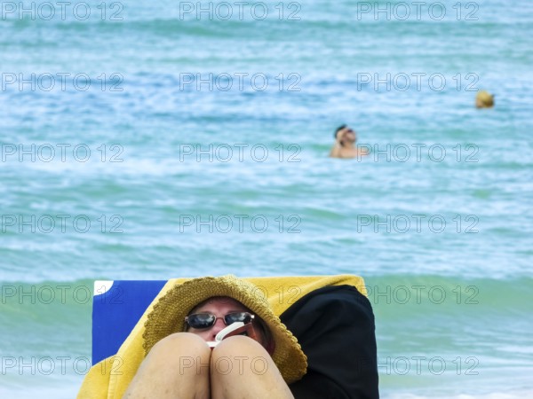 Sunbathing on loungers, reading on holiday, Varadero, Cuba, Matanzas, Cuba, Central America
