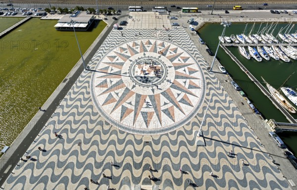 The large compass in the wave pavement in front of the Monumento a Los Descubrimientos, Lisbon, District of Lisbon, Portugal