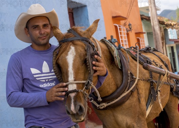 Cuban rider cowboy with his horse in the streets of Trinidad, Trinidad, Cuba, Sancti Spíritus, Cuba, Sancti Spíritus