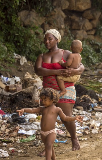 Mother with two children barefoot at a rubbish dump, poverty on the island of Cuba, Trinidad, Cuba, Sancti Spíritus, Cuba, Sancti Spíritus