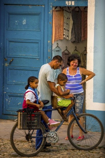 Street scene with children and bicycle in the old town of Trinidad, Trinidad, Cuba, Sancti Spíritus, Cuba, Sancti Spíritus
