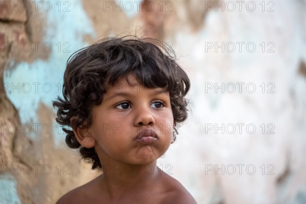 Little Cuban boy on the street in front of an old wall, Street scene in the old town of Trinidad, Trinidad, Cuba, Sancti Spíritus, Cuba, Sancti Spíritus