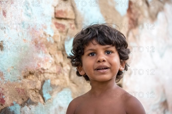 Little Cuban boy on the street in front of an old wall, Street scene in the old town of Trinidad, Trinidad, Cuba, Sancti Spíritus, Cuba, Sancti Spíritus