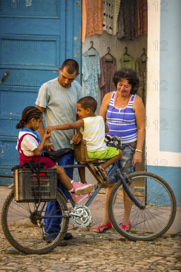 Street scene with children and bicycle in the old town of Trinidad, Trinidad, Cuba, Sancti Spíritus, Cuba, Sancti Spíritus