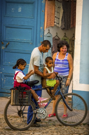 Street scene with children and bicycle in the old town of Trinidad, Trinidad, Cuba, Sancti Spíritus, Cuba, Sancti Spíritus