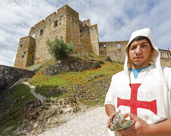 Brochure distributor dressed as Knights Templar in front of the castle, Fortress of Tomar, Castle of the Knights Templar, Templars, UNESCO cultural heritage, Tomar, Santarém district, Portugal, Europe, Convento da Ordem de Christo, Santarém district, aerial view, birds-eyes view, Travel, travel photography