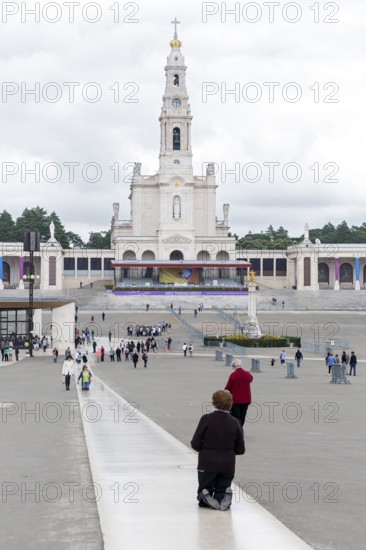 Penitents slide on their knees across the forecourt of the Basilica of Fatima, Fátima, District of Santarém, Portugal, Europe, Fátima, District of Santarém, Aerial view, birds-eyes view, Travel, Travel photography