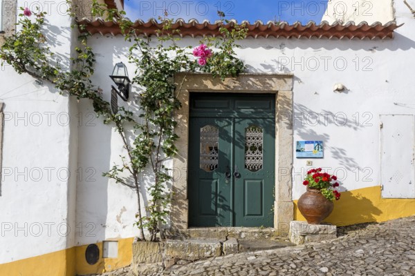 Rose-covered door, picturesque small town Obidos, Ãbidos, Leiria district, Portugal, Europe, Óbidos, aerial view, birds-eyes view, Travel, travel photography