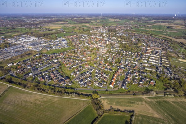 Aerial view, residential area, view of Bork district with distant view and blue sky, commercial area on the left, Selm, Münsterland, North Rhine-Westphalia, Germany, DE, Europe, property tax, real estate, aerial view, aerial photography, aerial photography, overview, bird's-eye view, residential area, living and living, residential area, residential quality, residential neighbourhood, housing estate, residential district, birds-eyes view, overview