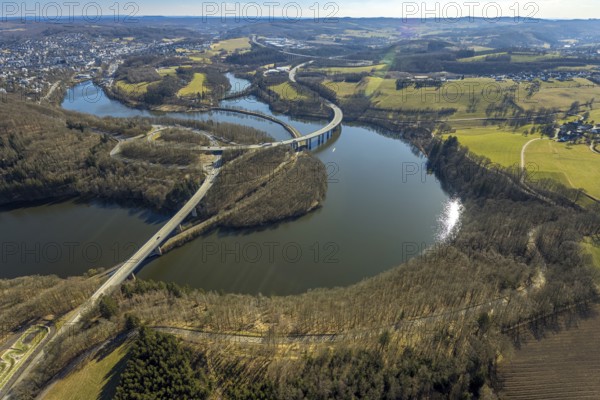 Aerial view, Biggesee with forest area, Obersee with bridge Landesstraße L512, curved bridge Bundesstraße B54, Olpe-Stadt, Olpe, Sauerland, North Rhine-Westphalia, Germany, Biggetalsperre, bridge, Bundesstraße B54, DE, Europe, shapes and colours, hilly landscape, aerial view, aerial photography, aerial photography, nature park Ebbegebirge, lake, reservoir, overview, bird's eye view, forebay, birds-eyes view, overview
