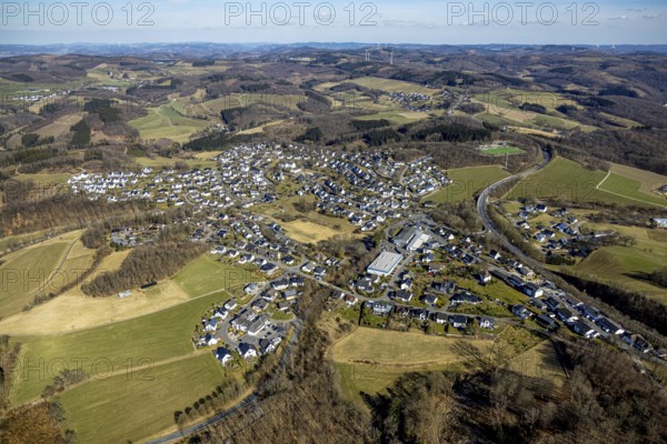 Aerial view, view of Rohde residential area, wooded area, hilly landscape, church of the parish of St. Cyriakus Rhode in the town centre, Franz-Hitze-Schule - kath. Primary school, Rhode, Olpe, Sauerland, North Rhine-Westphalia, Germany, place of worship, education, educational institution, DE, Europe, religious community, place of worship, primary school, holy site, church, parish, denomination, educational institute, aerial view, aerial photography, aerial photography, religion, religious site, school, overview, bird's-eye view, overview