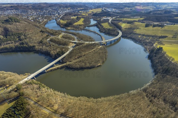 Aerial view, Biggesee with forest area, Obersee with bridge Landesstraße L512, curved bridge Bundesstraße B54, Olpe-Stadt, Olpe, Sauerland, North Rhine-Westphalia, Germany, Biggetalsperre, bridge, Bundesstraße B54, DE, Europe, shapes and colours, hilly landscape, aerial view, aerial photography, aerial photography, nature park Ebbegebirge, lake, reservoir, overview, bird's eye view, forebay, birds-eyes view, overview