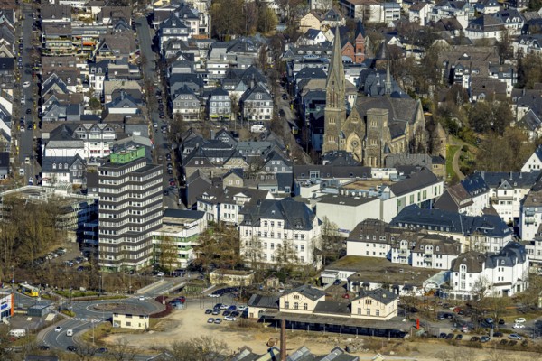 Aerial view, former Olpe railway station, left Olpe town hall, Altes Lyzeum (music school) and shopping centre, city and St. Martinus catholic church, roundabout Stellwerkstraße, Olpe city, Olpe, Sauerland, North Rhine-Westphalia, Germany, place of worship, authority, DE, Europe, religious community, place of worship, holy place, church, parish, denomination, aerial view, aerial photography, aerial photography, religion, religious site, overview, bird's eye view, birds-eyes view, overview