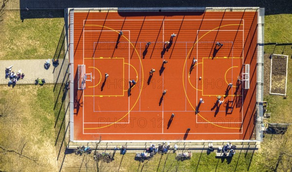 Aerial view, red football pitch at the Georg-Müller-Schule comprehensive school with pupils, shapes and colours, Schmandbruch, Wetter, Ruhr area, North Rhine-Westphalia, Germany, education, educational institution, football pitch, DE, Europe, football, comprehensive school, educational institute, aerial view, aerial photography, aerial photography, school, overview, bird's eye view, Wetter (Ruhr), birds-eyes view, overview