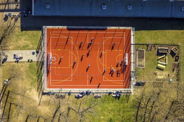 Aerial view, red football pitch at the Georg-Müller-Schule comprehensive school with pupils, shapes and colours, Schmandbruch, Wetter, Ruhr area, North Rhine-Westphalia, Germany, education, educational institution, football pitch, DE, Europe, football, comprehensive school, educational institute, aerial view, aerial photography, aerial photography, school, overview, bird's eye view, Wetter (Ruhr), birds-eyes view, overview