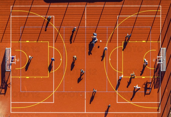 Aerial view, red football pitch at the Georg-Müller-Schule comprehensive school with pupils, shapes and colours, Schmandbruch, Wetter, Ruhr area, North Rhine-Westphalia, Germany, education, educational institution, football pitch, DE, Europe, football, comprehensive school, educational institute, aerial view, aerial photography, aerial photography, school, overview, bird's eye view, Wetter (Ruhr), birds-eyes view, overview