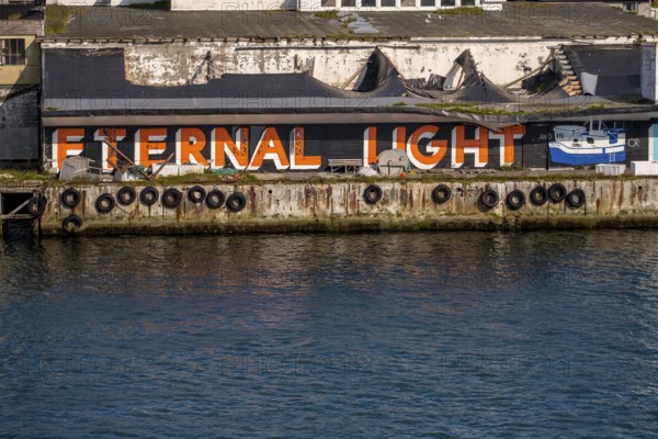 Street Art Eternal Light Eternal Night, in the harbour, Vardø, Finnmark, Norway, Scandinavia, Europe, adventure travel, tourism, graffiti eternal light eternal night, Hurtigruten, Hurtigruten voyage, cruise, NOR, travel, destination, sea voyage, sightseeing, tourism, Norwegian, Scandinavian, touristic