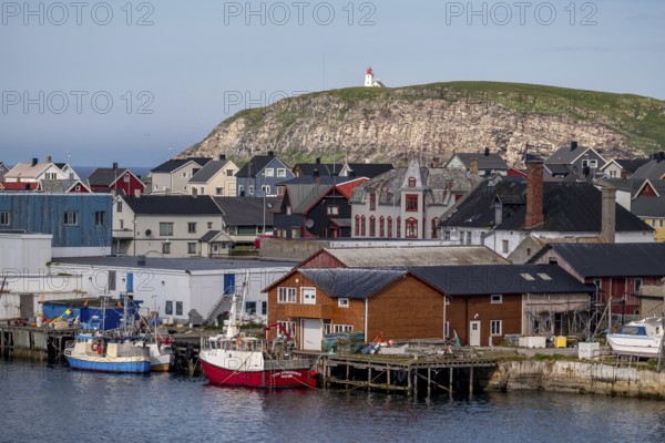 Fishing boats in the harbour, Vardø fyr on the island of Hornøya, lighthouse, Vardø, Finnmark, Norway, Scandinavia, Europe, adventure travel, boats, tourism, Hurtigruten, Hurtigruten cruise, cruise, NOR, pile dwellings, travel, destination, ship, ships, sea voyage, sightseeing, tourism, Norwegian, Scandinavian, tourist