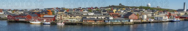 Panoramic photo harbour and town view, Street Art Eternal Light Eternal Night, observatory, church, Vardø, Finnmark, Norway, Scandinavia, Europe, adventure travel, place of worship, astronomy, tourism, religious community, place of worship, graffiti eternal light eternal night, Hurtigruten, Hurtigruten voyage, parish, denomination, cruise, NOR, panorama, panoramic view, panoramic photo, pile dwellings, travel, destination, religion, sea voyage, sightseeing, tourism, Vardø Church, Norwegian, Scandinavian, touristic