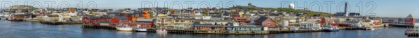 Panoramic photo harbour and town view, Street Art Eternal Light Eternal Night, observatory, church, Vardø, Finnmark, Norway, Scandinavia, Europe, adventure travel, place of worship, astronomy, tourism, religious community, place of worship, graffiti eternal light eternal night, Hurtigruten, Hurtigruten voyage, parish, denomination, cruise, NOR, panorama, panoramic view, panoramic photo, pile dwellings, travel, destination, religion, sea voyage, sightseeing, tourism, Vardø Church, Norwegian, Scandinavian, touristic