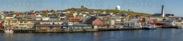 Panoramic photo harbour and town view, Street Art Eternal Light Eternal Night, observatory, church, Vardø, Finnmark, Norway, Scandinavia, Europe, adventure travel, place of worship, astronomy, tourism, religious community, place of worship, graffiti eternal light eternal night, Hurtigruten, Hurtigruten voyage, parish, denomination, cruise, NOR, panorama, panoramic view, panoramic photo, pile dwellings, travel, destination, religion, sea voyage, sightseeing, tourism, Vardø Church, Norwegian, Scandinavian, touristic