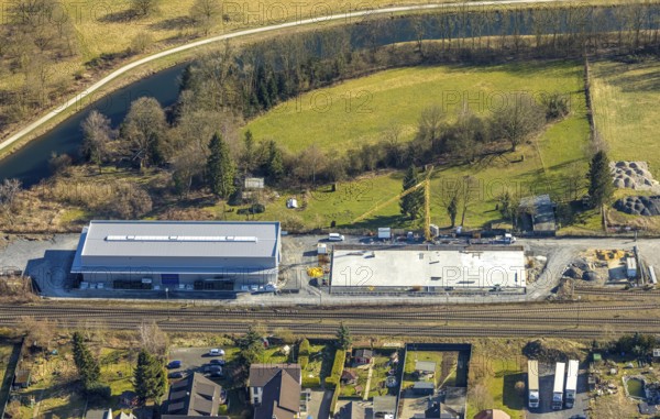 Aerial view, river Ruhr, construction site with new building on the road Zum Ostenfeld, railway tracks, Wickede/Ruhr, North Rhine-Westphalia, Germany, DE, Europe, aerial view, aerial photography, aerial photography, Ruhr area, overview, bird's-eye view, Wickede, Wickede (Ruhr), birds-eyes view, overview