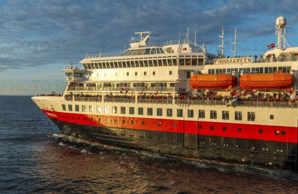 Tourists at the ship's railing, ship MS Finnmarken, Mehamn, Finnmark, Norway, Scandinavia, Europe, adventure trip, welcoming the passengers, tourism, Hurtigruten, Hurtigruten trip, cruise, cruise ship, liner service, NOR, passenger ship, shipping company Hurtigruten AS, travel, destination, shipping, sea voyage, sightseeing, tourism, Norwegian, Norwegian flag, Scandinavian, touristic