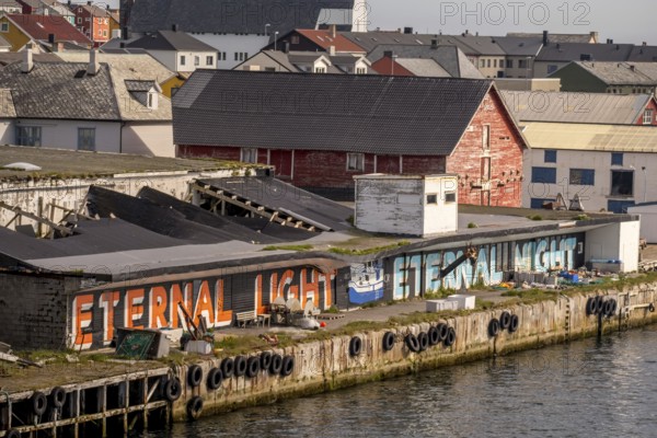 Street Art Eternal Light Eternal Night, harbour Vardø, Finnmark, Norway, Scandinavia, Europe, adventure travel, tourism, graffiti eternal light eternal night, Hurtigruten, Hurtigruten voyage, cruise, NOR, pile dwellings, travel, destination, sea voyage, sightseeing, tourism, Norwegian, Scandinavian, touristic, easternmost municipality of Norway