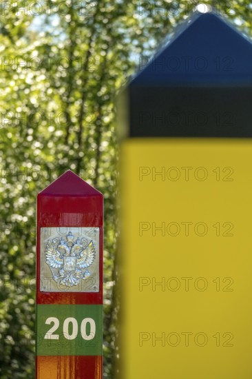 Border Norway-Russia, border posts, yellow border post Norway, red-green border post Russia, Kirkenes, Finnmark, Norway, Scandinavia, Europe, adventure travel, tourism, border markers, border stones, Hurtigruten, Hurtigruten voyage, cruise, land border, NOR, travel, travel destination, sea voyage, sightseeing, national border, tourism, Norwegian, Scandinavian, touristic