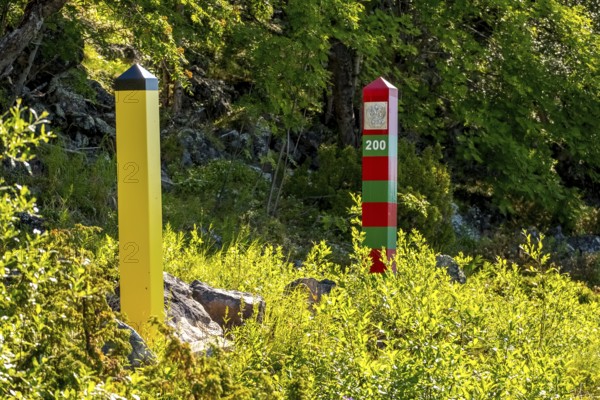 Border Norway-Russia, border posts, yellow border post Norway, red-green border post Russia, Kirkenes, Finnmark, Norway, Scandinavia, Europe, adventure travel, tourism, border markers, border stones, Hurtigruten, Hurtigruten voyage, cruise, land border, NOR, travel, travel destination, sea voyage, sightseeing, national border, tourism, Norwegian, Scandinavian, touristic