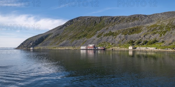 Foldalbruket kystkultursenter, museum, Norwegian house in red colours, jetty, mountainside, Kjøllefjord, Finnmark, Norway, Scandinavia, Europe, adventure travel, mountains, fjord, Foldalbruket Coastal Cultural Centre, tourism, wooden house, Hurtigruten, Hurtigruten trip, Kjøllefjord, cruise, coast, NOR, panorama, journey, destination, sea trip, sightseeing, tourism, Norwegian, red facade, Scandinavian, touristic, white windows