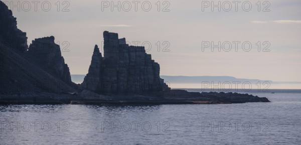 Finnkjerka rock formation, Kjøllefjord, Finnmark, Norway, Scandinavia, Europe, adventure trip, Finnkirka, fjord, tourism, backlight, Hurtigruten, Hurtigruten trip, Church of the Finns, Kjøllefjord, cliff, cruise, legends, NOR, natural monument, Sami sacrificial site, journey, destination, sea trip, sightseeing, tourism, Norwegian, Scandinavian, touristic