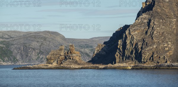 Finnkjerka rock formation, Kjøllefjord, Finnmark, Norway, Scandinavia, Europe, adventure trip, Finnkirka, fjord, tourism, Hurtigruten, Hurtigruten trip, Church of the Finns, Kjøllefjord, cliff, cruise, legends, NOR, natural monument, Sami sacrificial site, journey, destination, sea trip, sightseeing, tourism, Norwegian, Scandinavian, touristic