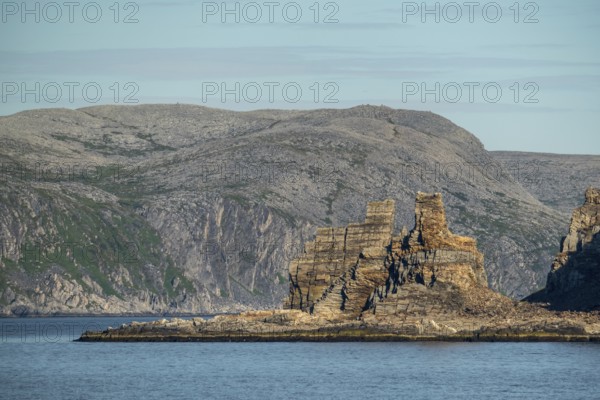 Finnkjerka rock formation, Kjøllefjord, Finnmark, Norway, Scandinavia, Europe, adventure trip, Finnkirka, fjord, tourism, Hurtigruten, Hurtigruten trip, Church of the Finns, Kjøllefjord, cliff, cruise, legends, NOR, natural monument, Sami sacrificial site, journey, destination, sea trip, sightseeing, tourism, Norwegian, Scandinavian, touristic