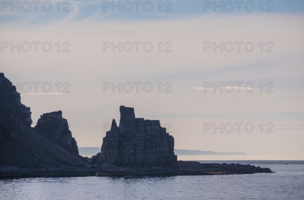 Finnkjerka rock formation, Kjøllefjord, Finnmark, Norway, Scandinavia, Europe, adventure trip, Finnkirka, fjord, tourism, backlight, Hurtigruten, Hurtigruten trip, Church of the Finns, Kjøllefjord, cliff, cruise, legends, NOR, natural monument, Sami sacrificial site, journey, destination, sea trip, sightseeing, tourism, Norwegian, Scandinavian, touristic