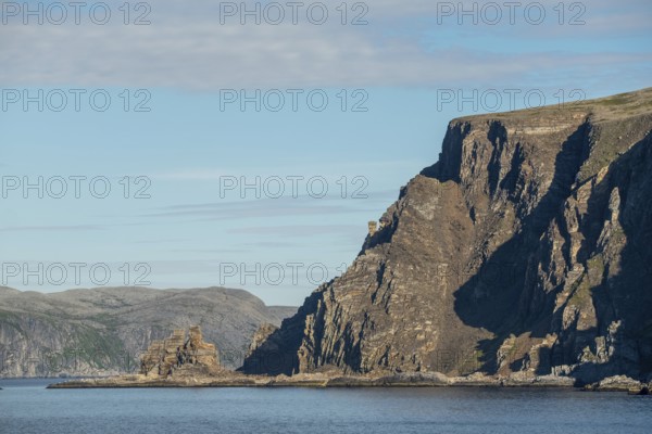 Finnkjerka rock formation, Kjøllefjord, Finnmark, Norway, Scandinavia, Europe, adventure trip, Finnkirka, fjord, tourism, Hurtigruten, Hurtigruten trip, Church of the Finns, Kjøllefjord, cliff, cruise, legends, NOR, natural monument, Sami sacrificial site, journey, destination, sea trip, sightseeing, tourism, Norwegian, Scandinavian, touristic