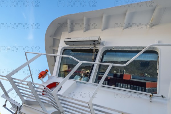 MS Polarlys, lookout of the bridge, officer on bridge, Honningsvåg, Finnmark, Norway, Scandinavia, Europe, adventure travel, tourism, Honningsvåg, Hurtigruten, Hurtigruten voyage, cruise, cruise ship, NOR, journey, destination, ship, shipping, ship bridge, sea voyage, sightseeing, tourism, Norwegian, Scandinavian, touristic