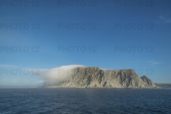 Island in the fog, Kjøllefjord, Finnmark, Norway, Scandinavia, Europe, adventure travel, tourism, Hurtigruten, Hurtigruten voyage, Kjøllefjord, cruise, NOR, fog, travel, destination, sea voyage, sightseeing, tourism, clouds, Norwegian, Scandinavian, touristic