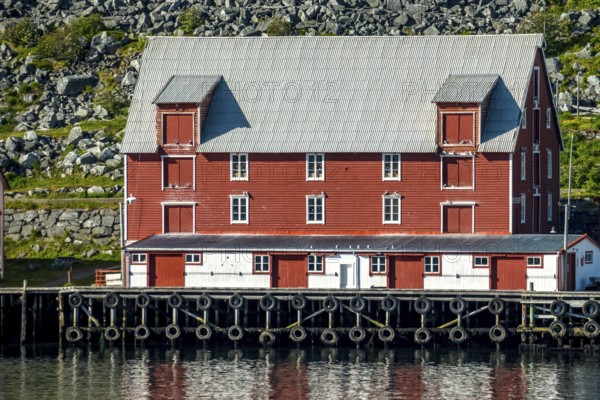 Foldalbruket kystkultursenter, museum, Norwegian house in red colours, jetty, Kjøllefjord, Finnmark, Norway, Scandinavia, Europe, adventure travel, fjord, Foldalbruket Coastal Cultural Centre, tourism, wooden house, Hurtigruten, Hurtigruten journey, Kjøllefjord, cruise, NOR, journey, destination, sea voyage, sightseeing, tourism, Norwegian, red facade, Scandinavian, tourist, white windows