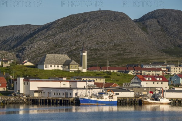 Town view and harbour, Mehamn Church, Mehamn, Finnmark, Norway, Scandinavia, Europe, adventure travel, place of worship, mountainside, tourism, religious community, place of worship, property tax, sacred site, Hurtigruten, Hurtigruten voyage, real estate, church, congregation, denomination, cruise, NOR, travel, destination, religion, religious site, ships, sea voyage, sightseeing, tourism, residential complex, living and life, residential area, residential buildings, quality of life, residential neighbourhood, housing estate, Norwegian, Scandinavian, touristic