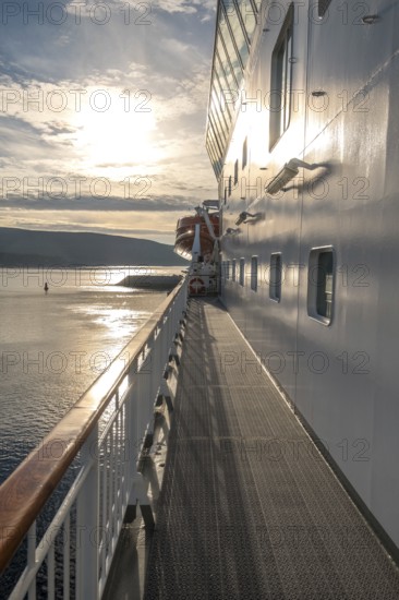 Ship railing in the evening light, Mehamn, Finnmark, Norway, Scandinavia, Europe, adventure travel, tourism, Hurtigruten, Hurtigruten voyage, cruise, cruise ship, NOR, journey, destination, railing, ship, ship MS Polarlys, shipping, sea voyage, sightseeing, tourism, Norwegian, Scandinavian, touristic