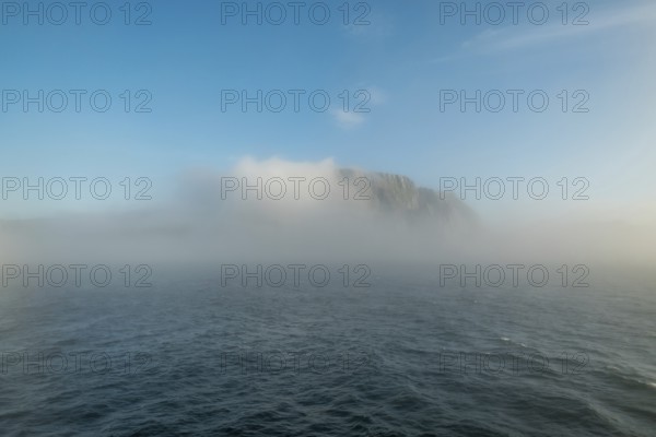 Island in the fog, Kjøllefjord, Finnmark, Norway, Scandinavia, Europe, adventure travel, tourism, Hurtigruten, Hurtigruten voyage, Kjøllefjord, cruise, NOR, fog, travel, destination, sea voyage, sightseeing, tourism, clouds, Norwegian, Scandinavian, touristic