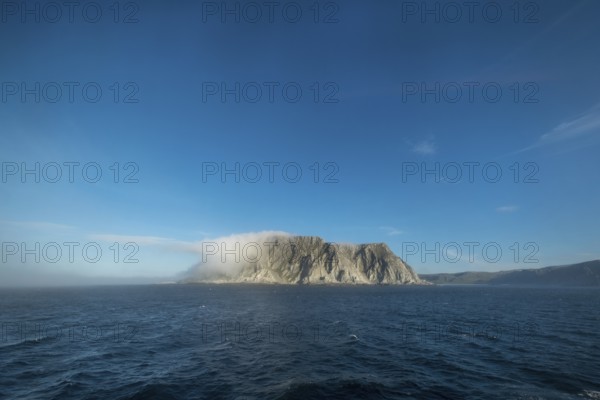 Island in the fog, Kjøllefjord, Finnmark, Norway, Scandinavia, Europe, adventure travel, tourism, Hurtigruten, Hurtigruten voyage, Kjøllefjord, cruise, NOR, fog, travel, destination, sea voyage, sightseeing, tourism, clouds, Norwegian, Scandinavian, touristic
