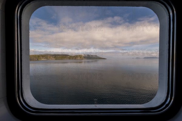 View from a ship's window, Måsøy, Finnmark, Norway, Scandinavia, Europe, adventure travel, tourism, Hurtigruten, Hurtigruten voyage, cruise, Måsøy, NOR, travel, destination, sea voyage, sightseeing, tourism, Norwegian, Scandinavian, touristic